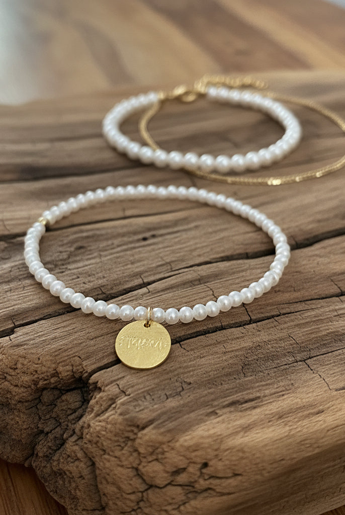 pearl bracelet on drift wood with the 2 barcelets in background