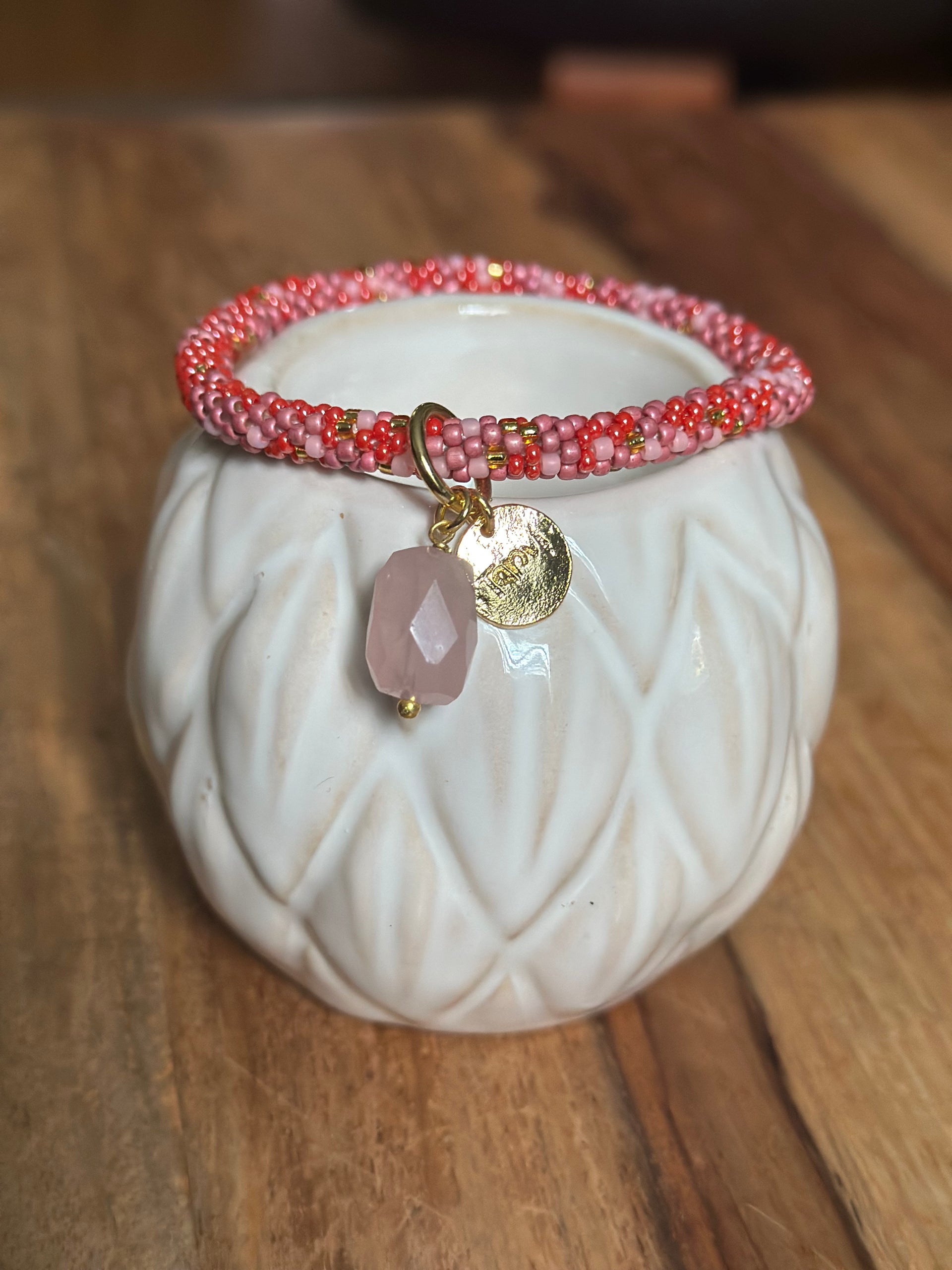 Pink Patterned Roll-on Bracelet with Gold Charm Gemstone (2